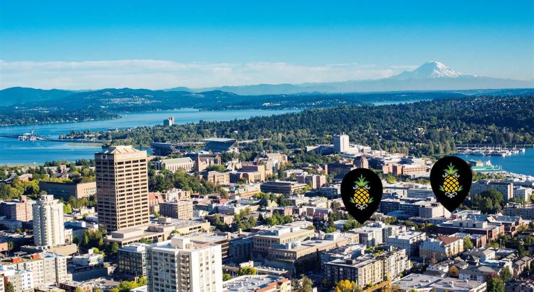 Arial view of the University of Washington campus with markers showing hotel location