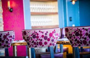 Colorful bar stools in one of our restaurants