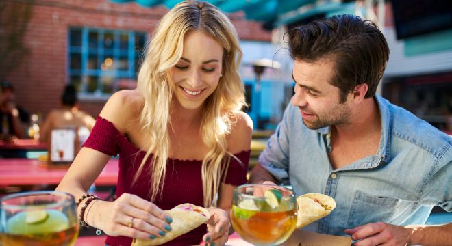 A Couple Eating Tacos