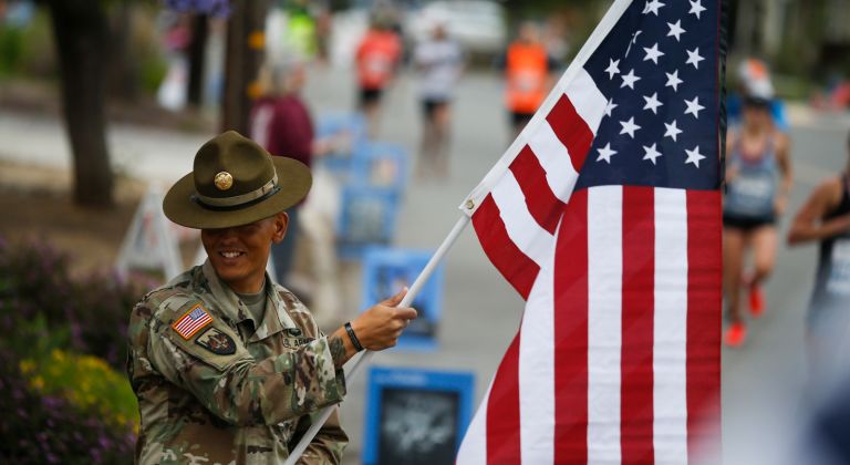 A Soldier Holding A Flag